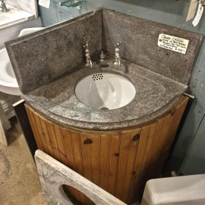 Soap stone bathroom corner sink.